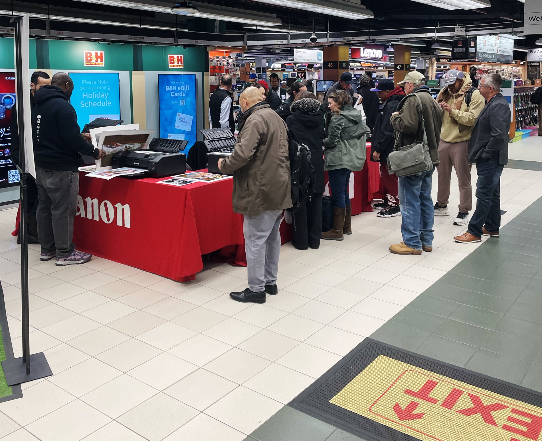 Customers exploring Canon printers and camera equipment during Canon Day at B&H